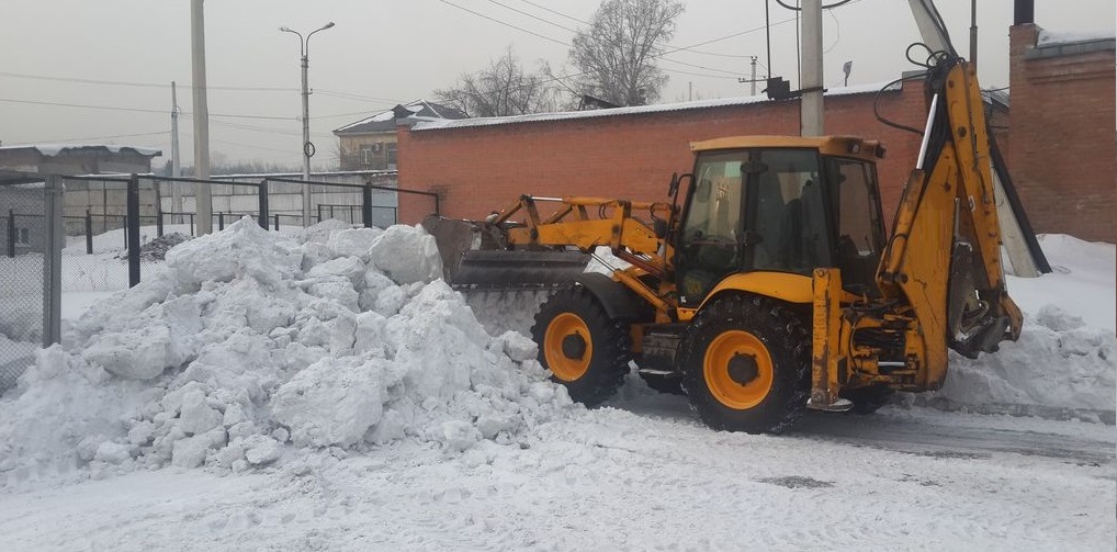 Экскаватор погрузчик для уборки снега и погрузки в самосвалы для вывоза в Белгородской области